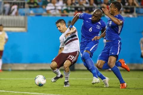 June 23, 2019: Mexico defender Fernando Navarro (19) gets past Martinique defenders to score the third goal of the CONCACAF Gold Cup soccer match between Martinique and Mexico held at Bank of America Stadium in Charlotte, NC. CSM 2019 CONCACAF Gold Cup: Martinique vs Mexico JUN 23 - ZUMAc04_ 20190623_zaf_c04_168 Copyright: xJonathanxHuffx
