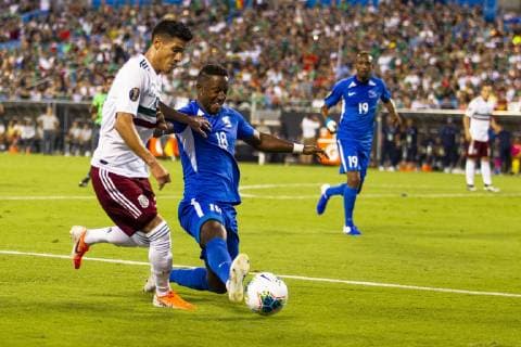 June 23, 2019: Mexico defender Jorge Sanchez (22) gets the ball knocked away by Martinique defender Samuel Camille (18) in the 2019 Gold Cup match at Bank of America Stadium in Charlotte, NC. ( ) 2019 CONCACAF Gold Cup: Martinique vs Mexico JUN 23 - ZUMAc04_ 20190623_zaf_c04_183 Copyright: xScottxKinserx