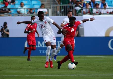 CHARLOTTE, NC - JUNE 23: Canada forward Jonathan David (20) and Cuba midfielder Aricheell Hernandez (10) fight for the ball during the 1st half of the CONCACAF Gold Cup game with Canada versus Cuba on June 23rd, 2019, at Bank of America Stadium in Charlotte, NC. (Photo by Jaylynn Nash Icon Sportswire) SOCCER: JUN 23 CONCACAF Gold Cup Group A - Canada v Cuba Icon19062300019