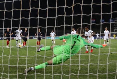 Reiss Nelson of England scores the first goal from the penalty spot during the UEFA Under-21 Championship 2019 match at San Marino Stadium, Serravalle. Picture date: 24th June 2019. Picture credit should read: Jonathan Moscrop Sportimage EDITORIAL USE ONLY. No use with unauthorised audio, video, data, fixture lists, club league logos or live services. Online in-match use limited to 120 images, no video emulation. No use in betting, games or single club league player publications. SPI-0105-0011