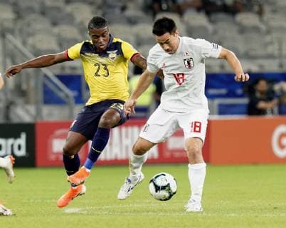 Football: Copa America Shinji Okazaki (18) of Japan and Jhegson Sebastian Mendez of Ecuador vie for the ball during the first half of a 1-1 draw in a Copa America Group C match on June 24, 2019, in Belo Horizonte, Brazil. 