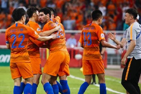 JINAN, CHINA - JUNE 25: Marouane Fellaini 25 of Shandong Luneng celebrates a point with teammates during the AFC Champions League Round of 16 2nd Leg match between Shandong Luneng and Guangzhou Evergrande at Jinan Olympic Sports Center Stadium on June 25, 2019 in Jinan, Shandong Province of China.  Copyright: xVCGx CFP111222845185 