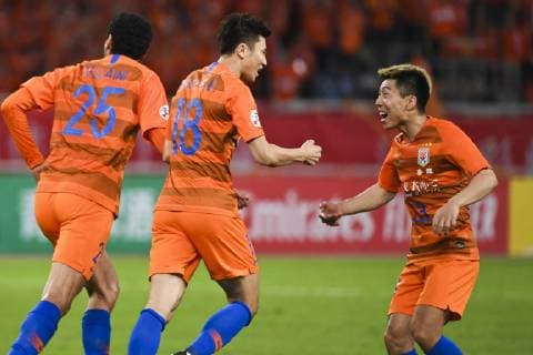 JINAN, CHINA - JUNE 25: Zhou Haibin 18 of Shandong Luneng celebrates a point with teammates during the AFC Champions League Round of 16 2nd Leg match between Shandong Luneng and Guangzhou Evergrande at Jinan Olympic Sports Center Stadium on June 25, 2019 in Jinan, Shandong Province of China.  Copyright: xVCGx CFP111222845699 