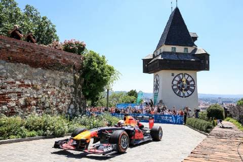 Sport Bilder des Tages FORMULA 1 - Projekt Spielberg, media day GRAZ,AUSTRIA,26.JUN.19 - MOTORPORTS, FORMULA 1 - Projekt Spielberg, media day, showrun with Max Verstappen. Image shows Max Verstappen (NLD Red Bull Racing) in an RB 7, the clocktower and fans. GEPAxpictures xMarioxBuehner