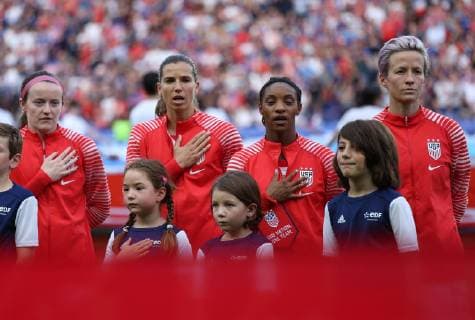 (From L to R) Rose Lavelle, Tobin Heath, Crystal Dunn and Megan Rapinoe of Team USA stand during the US national anthem before the start of the FIFA Women s World Cup quarterfinal match between the United States and France at the Parc des Princes near Paris on June 28, 2019. Team USA defeated France by the score of 2-1.  PAR201906287057 DAVIDxSILPA