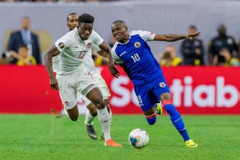 June 29, 2019 - Houston, Texas, USA - June 29, 2019 : Haiti midfielder Wilde-Donald Guerrier (10) and Canada midfielder Alphonso Davies (12) battle for the ball during a Concacaf Gold Cup Quarterfinals match between Haiti vs Canada at NRG Stadium in Houston, Texas. At the half Canada leads 2-0. ZUMA Press CONCACAF Gold Cup Quarterfinals 2019: Haiti vs Canada Jun 29 - ZUMAl153 20190629_zap_l153_008 Copyright: xMariaxLysakerx