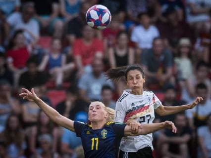 (190630) -- RENNES, June 30, 2019 -- Stina Blackstenius of Sweden vies with Sara Doorsoun of Germany during the quarterfinal between Germany and Sweden at the 2019 FIFA Women s World Cup at Roazhon Park in Rennes, France on June 29, 2019. Sweden won 2-1. ) (SP)FRANCE-RENNES-FIFA WOMEN S WORLD CUP-QUARTERFINALS-GER VS SWE XiaoxYijiu 