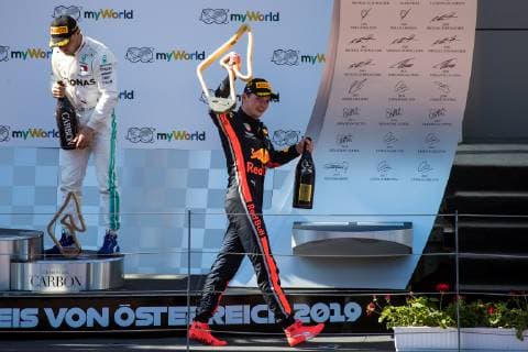 FORMULA 1 - GP of Austria 2019 SPIELBERG,AUSTRIA,30.JUN.19 - MOTORSPORTS, FORMULA 1 - Grand Prix of Austria, Red Bull Ring, award ceremony. Image shows Valtteri Bottas (FIN Mercedes) and the rejoicing of Max Verstappen (NED Red Bull Racing). GEPAxpictures xMaticxKlansek