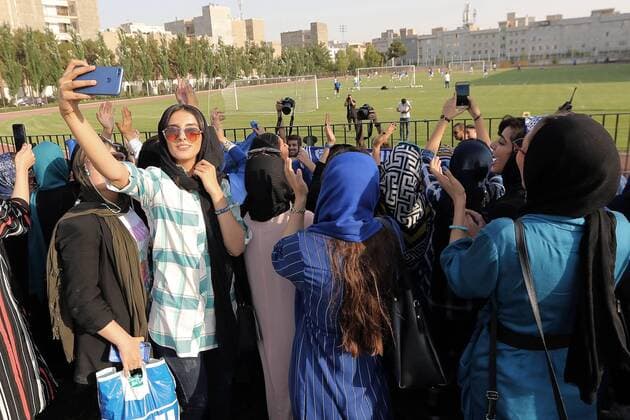 Iranian women sneak into soccer looks at his Esteghlal players ahead of before start the Persian Gulf Pro League 2019 2020,women who are already forbidden from watching the games in stadiums, on Jul 2, 2019, at in Tehran (photographer Amirhossein Kheirkhah) 