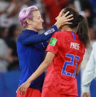 Megan Rapinoe (L) celebrates with Team USA teammate Cristen Press after the FIFA Women s World Cup semifinal match between the United States and England at the Stade de Lyon in Lyon, France on July 2, 2019. Team USA defeated England by the score of 2-1.  LYO201907027023 DAVIDxSILPA