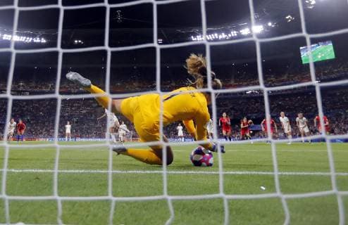 (190703) -- LYON, July 3, 2019 -- Goalkeeper Alyssa Naeher (front) of the United States saves the penalty kick by England s Steph Houghton during the semifinal between the United States and England at the 2019 FIFA Women s World Cup at Stade de Lyon in Lyon, France on July 2, 2019. ) (SP)FRANCE-LYON-FOOTBALL-FIFA WOMEN S WORLD CUP-SEMIFINALS-ENG VS USA DingxXu 