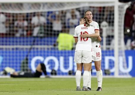 (190703) -- LYON, July 3, 2019 -- Fran Kirby (front) and Jade Moore of England hug each other after the semifinal between the United States and England at the 2019 FIFA Women s World Cup at Stade de Lyon in Lyon, France on July 2, 2019. ) (SP)FRANCE-LYON-FOOTBALL-FIFA WOMEN S WORLD CUP-SEMIFINALS-ENG VS USA DingxXu 