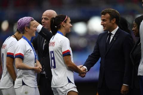 July 7, 2019 - Lyon, France - Emmanuel Macron, Head of State France whit Alex Morgan and Megan Rapinoe of United States after the 2019 FIFA Women s World Cup France Final match between The United State of America and The Netherlands at Stade de Lyon on July 7, 2019 in Lyon, France. United States of America v Netherlands : Final - 2019 FIFA Women s World Cup France  - ZUMAn230 20190707_zaa_n230_373 Copyright: xJosexBretonx