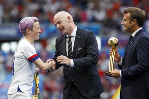 USA x Holland LYON, LY - 07.07.2019: USA X HOLLAND - Megan Rapinoe of the United States receives gold ball from FIFA President Gianni Infantino and the President of France Emmanuel Macron after the United States wins the 2019 FIFA Women& 39;s World Cup Final 2-0 against the Netherlands at the Lyon Stadium, in Lyon, France. (Photo: Richard Callis Fotoarena) x1759467x  RichardxCallis