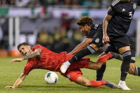 CHICAGO, IL - JULY 07: USA midfielder Christian Pulisic (10) is fouled by Mexico midfielder Jonathan Dos Santos (6) in the second half during the CONCACAF Gold Cup final match between the United States and Mexico on July 07, 2019, at Soldier Field in Chicago, IL. (Photo By Daniel Bartel Icon Sportswire) SOCCER: JUL 07 CONCACAF Gold Cup Finals - USA v Mexico Icon190707021