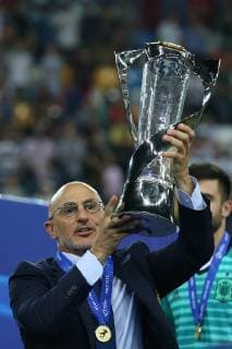 Luis de la Fuente manager of Spain celebrates with the Winners Trophy during the UEFA Under-21 Championship match at Stadio Friuli. Picture date: 30th June 2019. Picture credit should read: Jonathan Moscrop Sportimage EDITORIAL USE ONLY. No use with unauthorised audio, video, data, fixture lists, club league logos or live services. Online in-match use limited to 120 images, no video emulation. No use in betting, games or single club league player publications. SPI-0108-0248