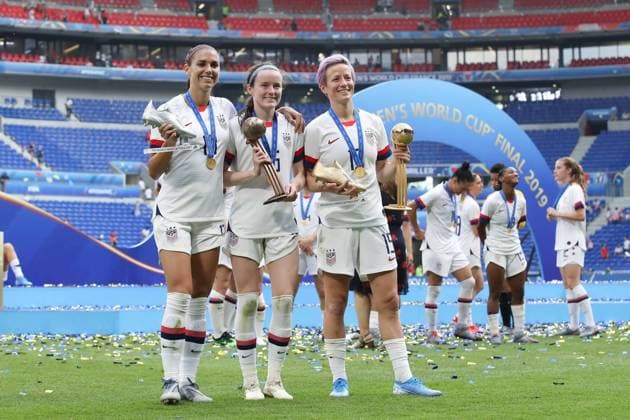 Alex Morgan, Rose Lavelle and Megan Rapinoe of USA pose with their trophies after the FIFA Women s World Cup match at Stade de Lyon, Lyon. Picture date: 7th July 2019. Picture credit should read: Jonathan Moscrop Sportimage EDITORIAL USE ONLY. No use with unauthorised audio, video, data, fixture lists, club league logos or live services. Online in-match use limited to 120 images, no video emulation. No use in betting, games or single club league player publications. SPI-0113-0316