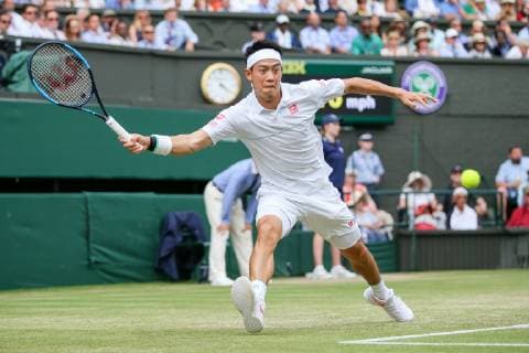 Kei Nishikori of Japan during the men s singles quarter-final match of the Wimbledon Lawn Tennis Championships against Roger Federer of Switzerland at the All England Lawn Tennis and Croquet Club in London, England on July 10, 2019.  (107695365)