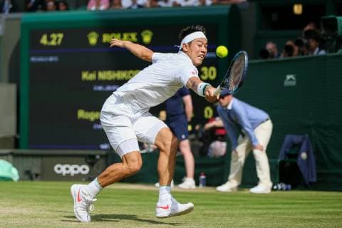 Kei Nishikori of Japan during the men s singles quarter-final match of the Wimbledon Lawn Tennis Championships against Roger Federer of Switzerland at the All England Lawn Tennis and Croquet Club in London, England on July 10, 2019.  (107695387)