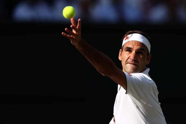 12th July 2019, The All England Lawn Tennis and Croquet Club, Wimbledon, England, Wimbledon Tennis Tournament, Day 11; Roger Federer (SUI) serves to Rafael Nadal (ESP)  ActionPlus12153212 ShaunxBrooks