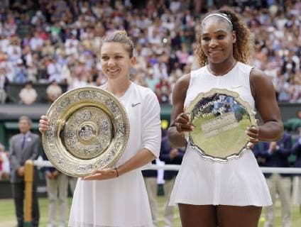 Tennis: Wimbledon championships Wimbledon champion Simona Halep (L) of Romania and runner-up Serena Williams of the United States pose with their trophies on July 13, 2019. 