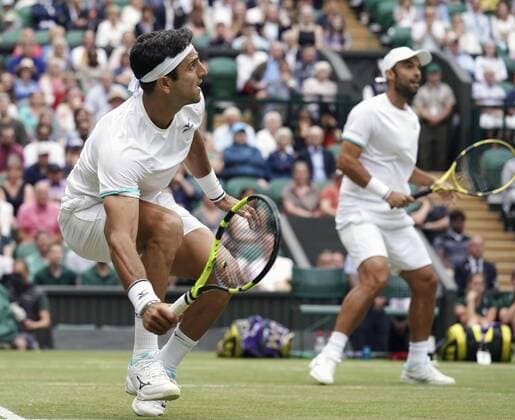 Tennis: Wimbledon championships Colombia s Robert Farah (L) and Juan Sebastian Cabal play in the Wimbledon men s doubles final against France s Nicolas Mahut and Edouard Roger-Vasselin on July 13, 2019. 