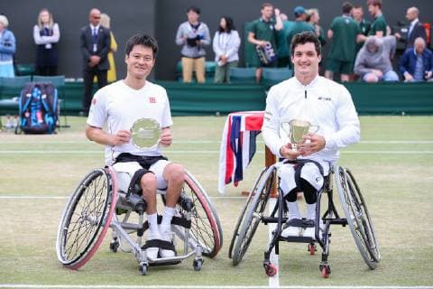 Sport Bilder des Tages Shingo Kunieda of Japan and Gustavo Fernandez of Argentina pose with the trophy after the men s wheelchair singles final match of the Wimbledon Lawn Tennis Championships at the All England Lawn Tennis and Croquet Club in London, England on July 14, 2019.  (107962215)