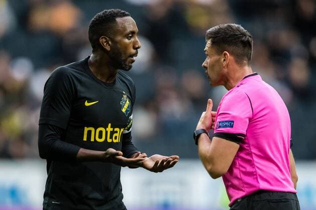 190717 Henok Goitom of AIK and referee Robert Hennessy during the UEFA Champions League qualifying match between AIK and Ararat-Armenia on July 17, 2019 in Stockholm. Copyright: ANDREASxLxERIKSSON BB190717AE011