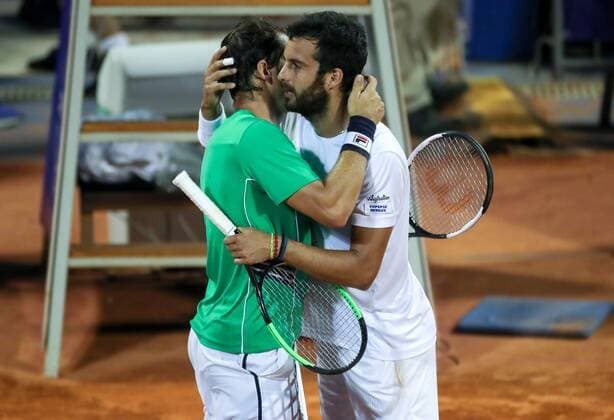 (190721) -- UMAG, July 21, 2019 -- Dusan Lajovic (L) of Serbia greets Salvatore Caruso of Italy during the semi-finals at 2019 ATP, Tennis Herren Croatia Open in Umag, Croatia, on July 20, 2019. Caruso handed over the match due to injury. Igor Kralj) (SP)CROATIA-UMAG-TENNIS-CROATIA OPEN UMAG 2019 GoranxStanzl 