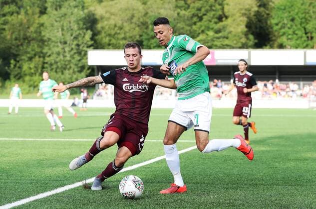 Copenhagen s Karlo Bartolec (left) and The New Saints Dean Ebbe battle for the ball during the UEFA Champions League second qualifying round first leg match at Park Hall Stadium, Oswestry. , Oswestry Denmark