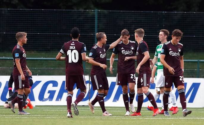 Copenhagen s Robert Skov (no. 29) celebrates scoring his side s second goal of the game from the penalty spot with team-mates during the UEFA Champions League second qualifying round first leg match at Park Hall Stadium, Oswestry. , Oswestry Denmark