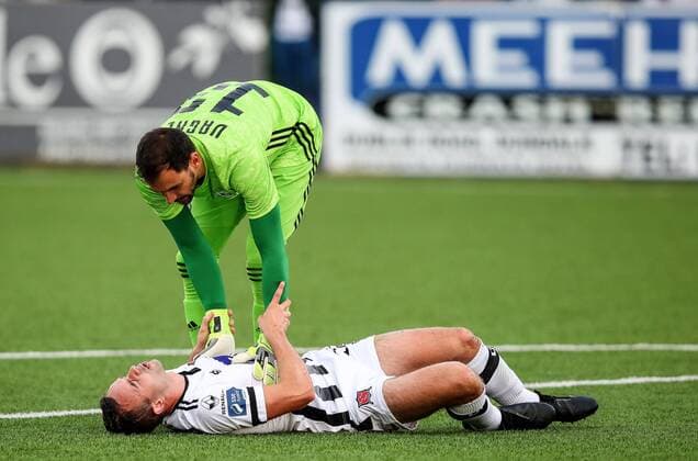 UEFA Champions League Second Qualifying Round First Leg, Oriel Park, Co. Louth 24 7 2019 Dundalk vs Qarabag Dundalk s Robbie Benson down injured as Vagner of Qarabag checks on him Robbie Benson down injured as Vagner checks on him 24 7 2019  Copyright: x©INPHO RyanxByrnex RB3_5166