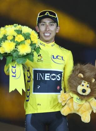 Egan Bernal of Colombia attends the presentation ceremony after winning the Tour de France in Paris on Sunday, July 28, 2019. Bernal claimed his first Tour de France victory, becoming the youngest winner of the race in the post-war era.  PAR20190728708 DAVIDxSILPA