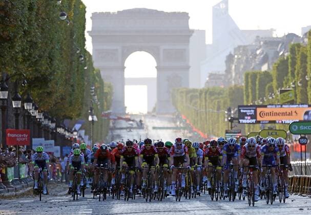 Competitors ride along the Champs-Elysees during the final stage of the Tour de France in Paris on Sunday, July 28, 2019. Egan Bernal claimed his first Tour de France victory, becoming the youngest winner of the race in the post-war era.  PAR20190728733 DAVIDxSILPA