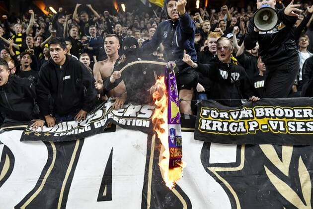 AIK supporters set a Maribor scarf on fire during the UEFA Champions League second qualifying round leg 2 soccer match between AIK and NK Maribor (Slovenia) at Friends Arena in Stockholm, Sweden, on July 31,2019. Stockholm SWEDEN SOCCER x11880x