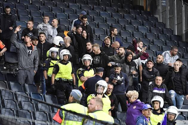 Police protect Maribor supporfters after masked AIK supporters tried to attack Maribor fans on the stands during the UEFA Champions League second qualifying round leg 2 soccer match between AIK and NK Maribor (Slovenia) at Friends Arena in Stockholm, Sweden, on July 31,2019. Stockholm SWEDEN SOCCER x11880x