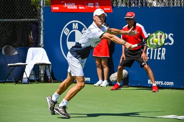 MONTREAL, QC - AUGUST 05: Marton Fucsovics (HUN) returns the ball with a backhand shot during the ATP, Tennis Herren Coupe Rogers first round match on August 5, 2019 at IGA Stadium in Montreal, QC (Photo by David Kirouac Icon Sportswire) TENNIS: AUG 05 Coupe Rogers Icon190805006