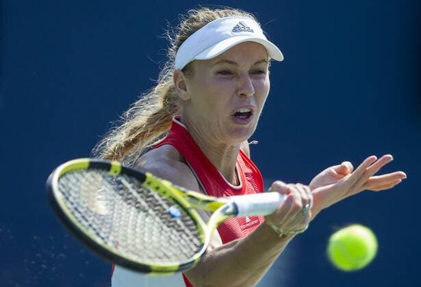 (190806) -- TORONTO, Aug. 6, 2019 -- Caroline Wozniacki of Denmark returns the ball during the first round of women s singles match against Yulia Putintseva of Kazakhstan at the 2019 Rogers Cup in Toronto, Canada, Aug. 5, 2019. ) (SP)CANADA-TORONTO-TENNIS-ROGERS CUP-WOMEN S SINGLES ZouxZheng 