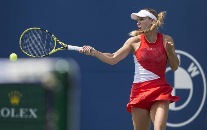 (190806) -- TORONTO, Aug. 6, 2019 -- Caroline Wozniacki of Denmark returns the ball during the first round of women s singles match against Yulia Putintseva of Kazakhstan at the 2019 Rogers Cup in Toronto, Canada, Aug. 5, 2019. ) (SP)CANADA-TORONTO-TENNIS-ROGERS CUP-WOMEN S SINGLES ZouxZheng 