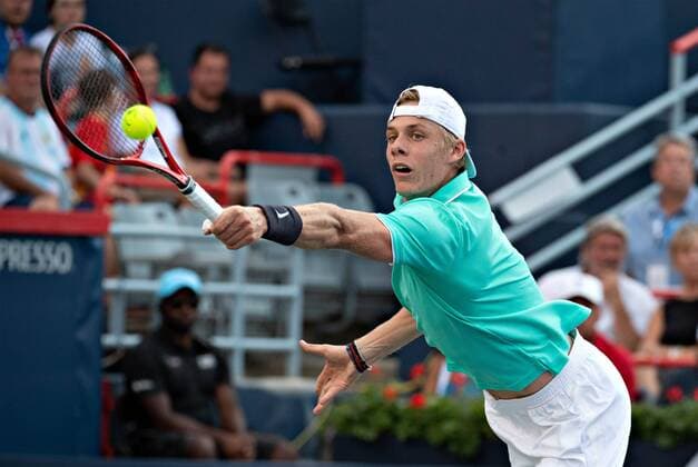 (190806) -- MONTREAL, Aug. 6, 2019 (Xinhua) -- Denis Shapovalov of Canada returns the ball during the first round of men s singles match against Pierre-Hugues Herbert of France at the 2019 Rogers Cup in Montreal, Canada, Aug. 5, 2019. (Xinhua Andrew Soong) (SP)CANADA-MONTREAL-TENNIS-ROGERS CUP-MEN S SINGLES 