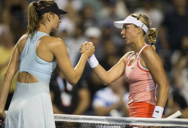 (190806) -- TORONTO, Aug. 6, 2019 -- Maria Sharapova(L) of Russia shakes hands with Anett Kontaveit of Estonia after the first round of women s singles match between Maria Sharapova of Russia and Anett Kontaveit of Estonia at the 2019 Rogers Cup in Toronto, Canada, Aug. 5, 2019. ) (SP)CANADA-TORONTO-TENNIS-ROGERS CUP-WOMEN S SINGLES ZouxZheng 