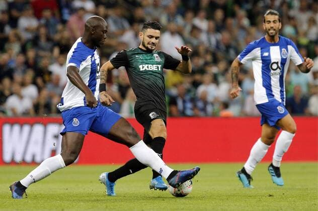 KRASNODAR, RUSSIA - AUGUST 7, 2019: Players of FC Krasnodar and FC Porto fight for the ball in their 2019 20 UEFA Champions League third qualifying round match at Krasnodar Stadium. Valery Matytsin TASS  TS0B5B25
