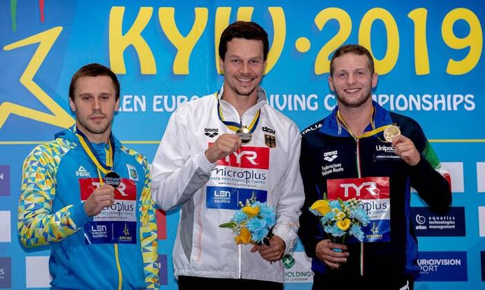 Bilder des Jahres 2019, Sport 08 August Sport Themen der Woche KW32 Sport Bilder des Tages (L to R) KOLODIY OLEG UKR Ukraina silver medal, HAUSDING PATRICK GER Germany Gold Medal, MARSAGLIA LORENZO ITA Italy bronze medal Kyiv, Ukraine UKR 07 08 2019 Diving 1 meter springboard men podium Len European Diving Championships 2019 Arena Liko Kyiv, Ukraine Photo Â© Giorgio Scala Deepbluemedia Insidefoto GiorgioxScala