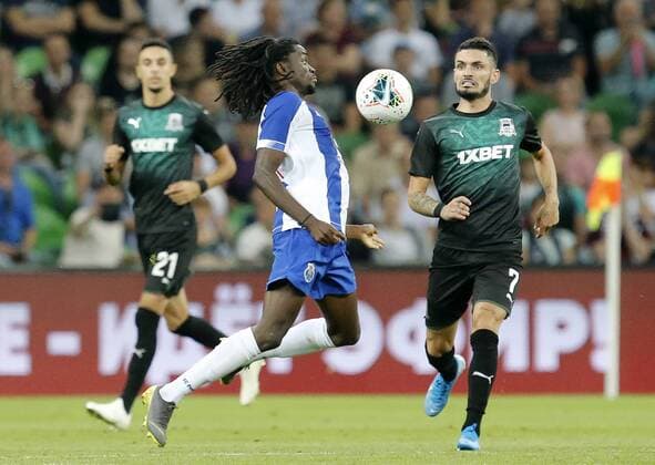 KRASNODAR, RUSSIA - AUGUST 7, 2019: Krasnodar s Younes Namli, Porto s Romario Baro, and Krasnodar s Remy Cabella (L-R) in action in the 2019 20 UEFA Champions League third qualifying round match between FC Krasnodar and FC Porto at Krasnodar Stadium. Valery Matytsin TASS  TS0B5B4E