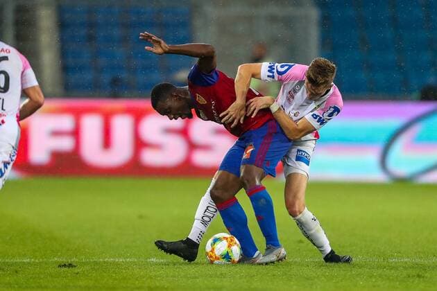 SOCCER - CL quali, Basel vs LASK BASEL,SWITZERLAND,07.AUG.19 - SOCCER - UEFA Champions League qualification, FC Basel vs Linzer ASK. Image shows Afimico Pululu (Basel) and Philipp Wiesinger (LASK). GEPAxpictures xPhilippxBrem