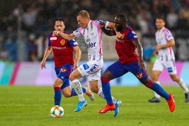 SOCCER - CL quali, Basel vs LASK BASEL,SWITZERLAND,07.AUG.19 - SOCCER - UEFA Champions League qualification, FC Basel vs Linzer ASK. Image shows Thomas Goiginger (LASK) and Eder Balanta (Basel). GEPAxpictures xPhilippxBrem