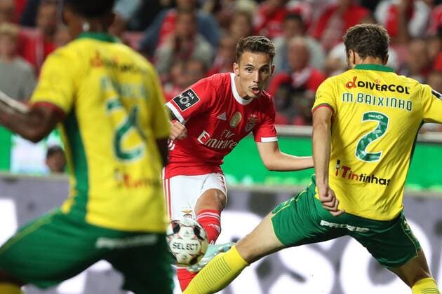 (190811) -- LISBON, Aug. 11, 2019 -- Benfica s Alejandro Grimaldo (C) vies with Pacos de Ferreira s Marco Baixinho (R) during the Portuguese league football match between Benfica and Pacos de Ferreira in Lisbon, Portugal, on Aug. 10, 2019. ) (SP)PORTUGAL-LISBON-SOCCER-PORTUGUESE LEAGUE-BENFICA VS PACOS DE FERREIRA PetroxFiuza 
