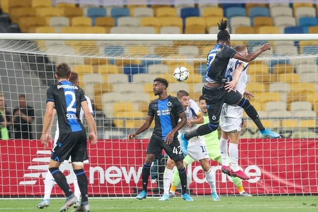 Club s Simon Deli (2R) scores the 1-1 goal during a soccer game between Ukrainian club Dynamo Kyiv and Belgian team Club Brugge KV, Tuesday 13 August 2019 in Kyiv, Ukraine, the return match in the third qualifying round of the UEFA Champions League. Club won the first leg 1-0. BRUNOxFAHY  x05642861x