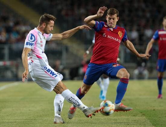 SOCCER - CL qualification, LASK vs Basel LINZ,AUSTRIA,13.AUG.19 - SOCCER - UEFA Champions League, qualification, LASK vs FC Basel. Image shows Rene Renner (LASK) and Fabian Frei (Basel). GEPAxpictures xWalterxLuger