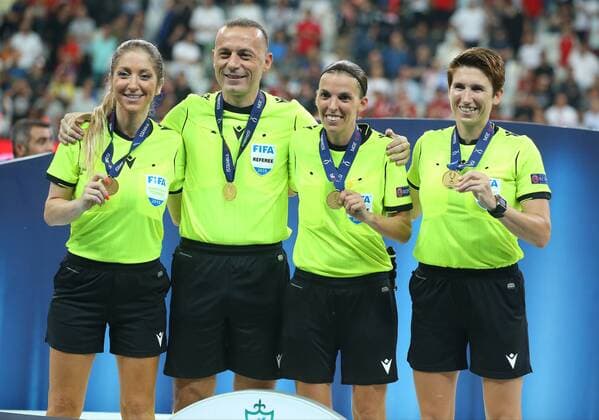 Referees L-R , Manuela Nicolosi , Cuneyt Cakir , Stephanie Frappart and Michelle O Neill at the trophy ceremony before the UEFA SUPERCUP match between Liverpool and Chelsea at Vodafone Park in Istanbul , Turkey on August 14 , 2019. 